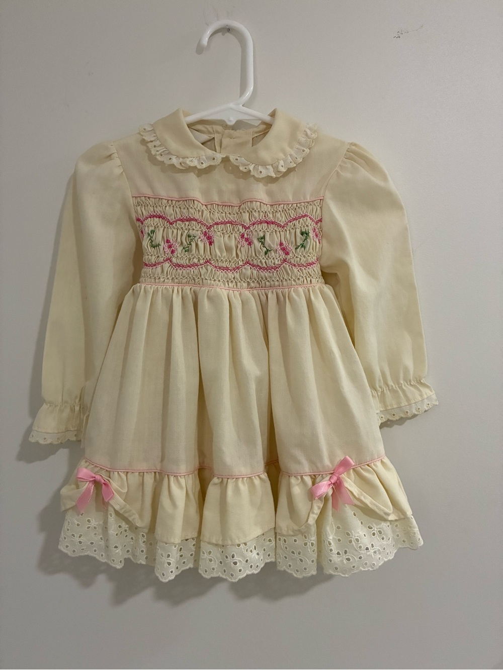 Vintage Smocked Long-Sleeve Girls Dress with Pink Ribbon Accents